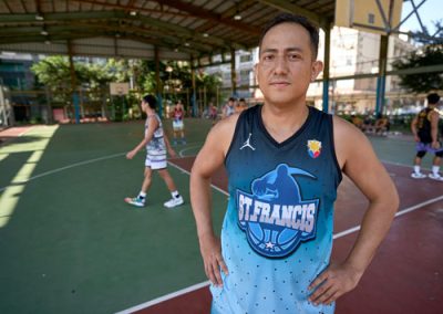 Jayson de Guzmán, injured on the job and then forced out of employee housing, plays basketball as part of Ugnayan's recreational activities to relieve stress. (Paul Jeffrey/Taiwan)