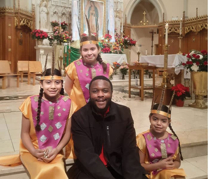 Joshua Maondo assists at a parish celebration at St. Basil Church in Chicago. (Courtesy of Joshua Maondo/U.S.)