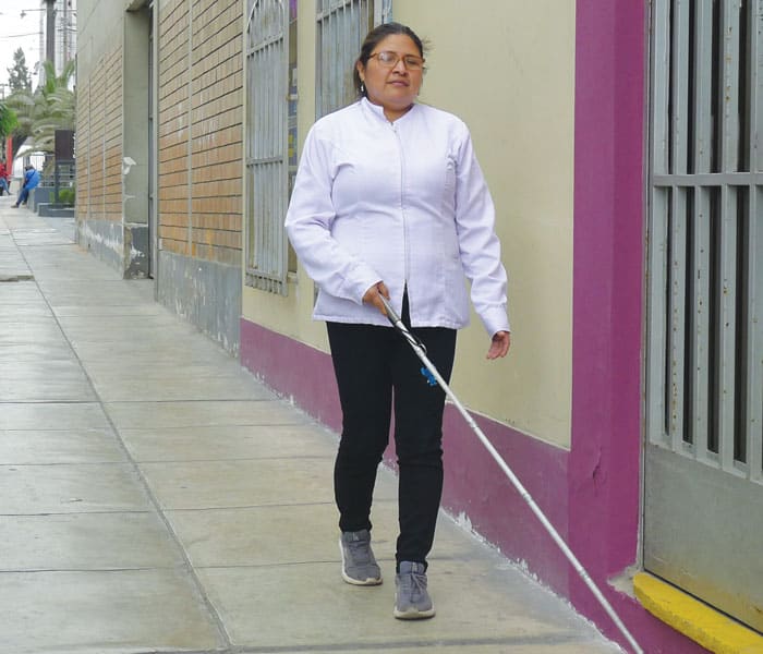 María Inés Aspilcueta walks to her therapy center, located in a shopping center. Aspilcueta belonged to the first class of blind therapists trained in massage by Casa Bartimeo del Sur. (Lynn Monahan/Peru)