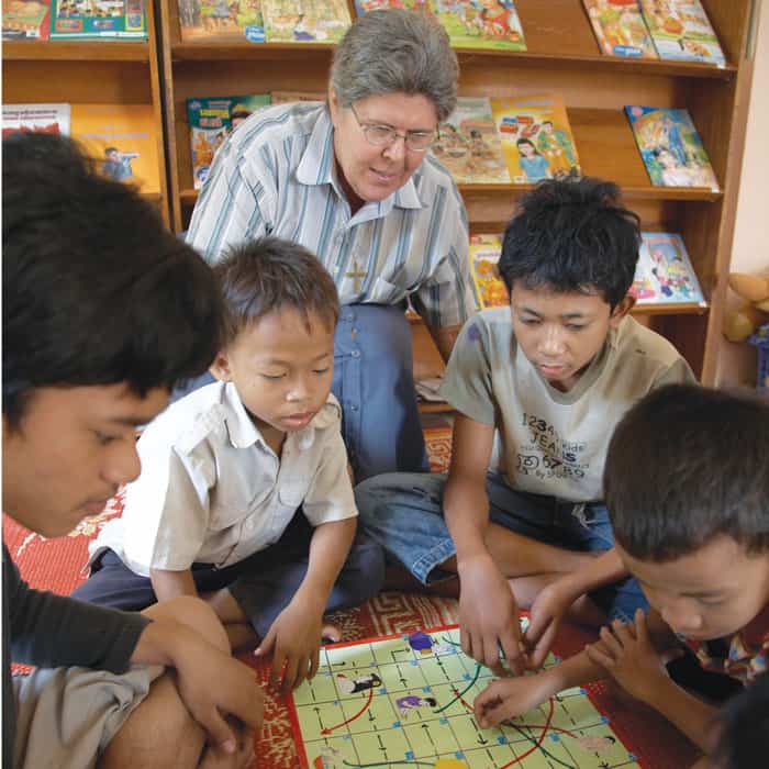 40-44-Sr-Pellicore-03 Maryknoll Regina Pellicore engages with students in one of many educational projects run by the Maryknoll Sisters in Beoung Tum Pun, a marginalized area outside of Cambodia’s capital, Phnom Penh. (Sean Sprague/Cambodia)