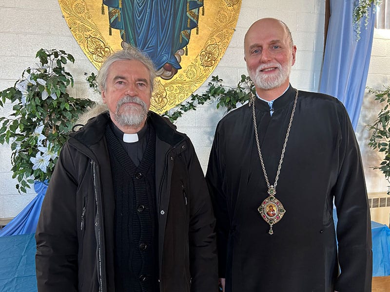 After World Mission Sunday Mass at St. Ferdinand Church, pastor Father Jason Torba and Cardinal Blase Cupich greet the congregation, including all those who do mission in Chicago. (Julie Jaidinger, Chicago Catholic/U.S.)