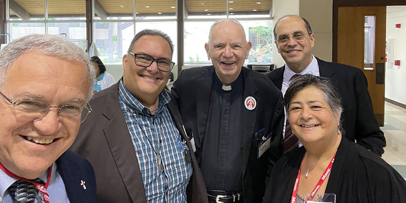 At a national conference on Hispanic ministry with Deacon Eddy Valbuena and Alejandro Aguilera-Titus, assistant director for Hispanic Ministry for the U.S. Conference of Catholic Bishops. (Courtesy of Arturo and Esperanza Monterrubio/U.S.)