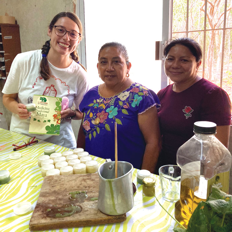 W25-trip-merida-2 Participant Brinkley Johnson (far left) and two local partners create traditional Mayan herbal products at U Yits Ka’an. (Courtesy of Brinkley Johnson/Mexico)