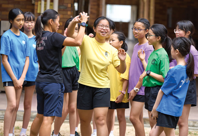 Secondary section students throw the shot during physical education class. MCS offers 64 extracurricular clubs and teams focused on sports, music, service and academics. (Paul Jeffrey/Hong Kong)