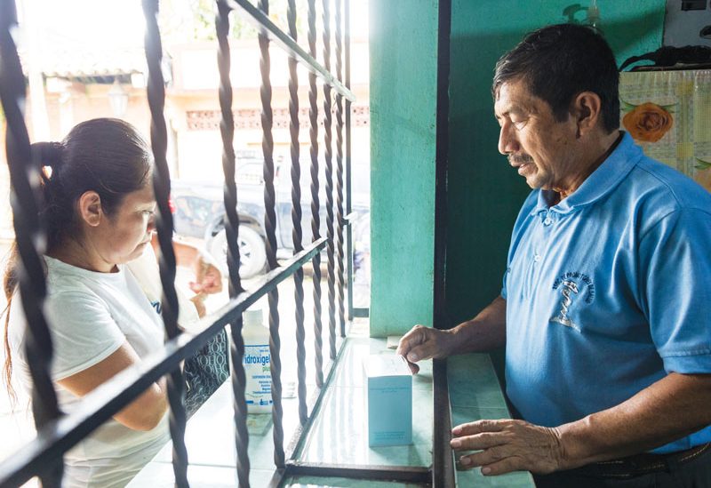 Carlos Romeo Orozco, a health promoter, works at the program’s dispensary in Catarina which provides medications at affordable prices. (Octavio Durán/Guatemala)
