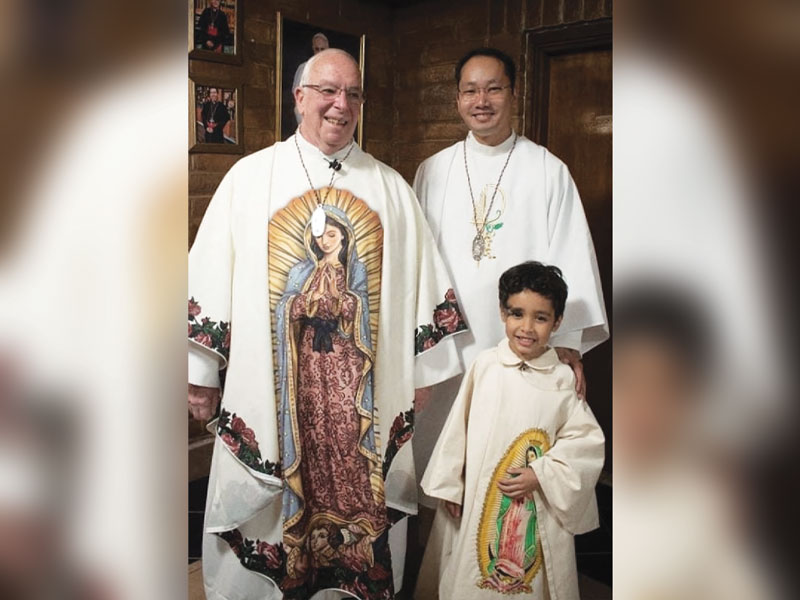In El Paso, Texas, Deacon Sim and Maryknoll Father Raymond Finch celebrate the Feast of Our Lady of Guadalupe on Dec. 12 with a young parishioner. (Courtesy of Matthew Sim/U.S.)