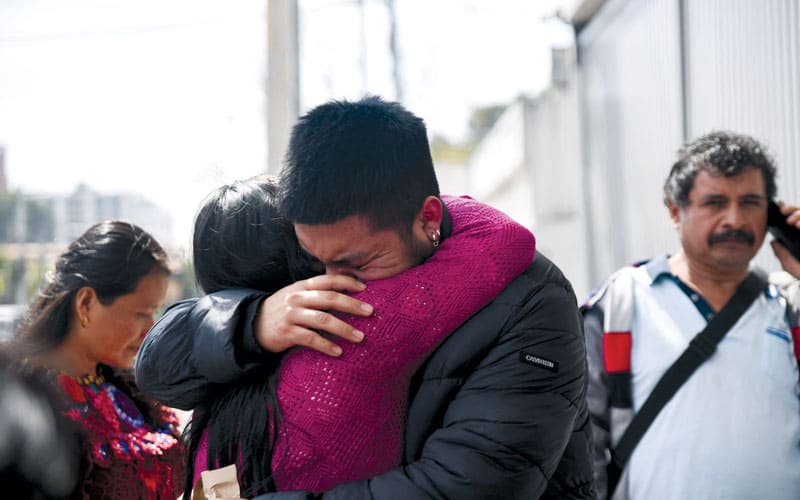 A migrant is welcomed by a family member at the migrant reception center in Guatemala City in January, after he and other migrants were deported from the U.S earlier this year. (OSV, Cristina Chiquin, Reuters/Guatemala