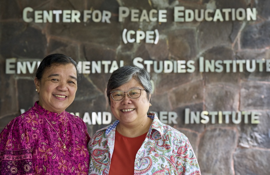 Melinda Medina Lamorena (left) and Maryknoll Sister Marvie Misolas pose in the Environmental Studies Institute of Miriam College in Quezon City, Philippines. Misolas is executive director of the institute, and Lamorena, known as "Mei", is the associate director.