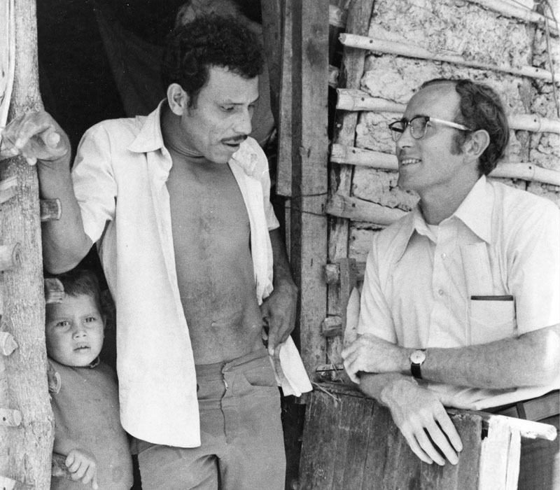 Father Spain visits a family in Tutunichapa, a poor area in metropolitan San Salvador settled by people displaced by war and earthquakes. (Eric Wheater/El Salvador)