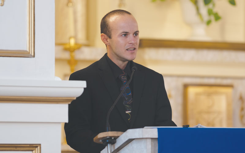 Candidate James Pawlowicz, assigned to Brazil, serves as lector. (José García/U.S.)