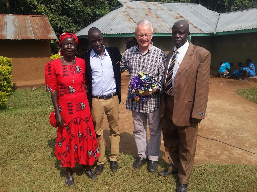 Maryknoll Father Lance Nadeau, then a university chaplain for Kenyatta University students, meets young Victor Mutobera’s parents Roselyn Barasa and Timothy Mutobera in 2019. (Courtesy of Victor Mutobera/Kenya)