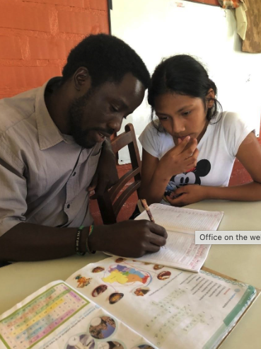 As part of his overseas training, Mutobera tutors at-risk students at the Cristo Rey home for youth in Cochabamba, Bolivia. During their vocational discernment, Maryknoll seminarians and brother candidates serve in various ministries in cross-cultural contexts. (Courtesy of Victor Mutobera/Bolivia)