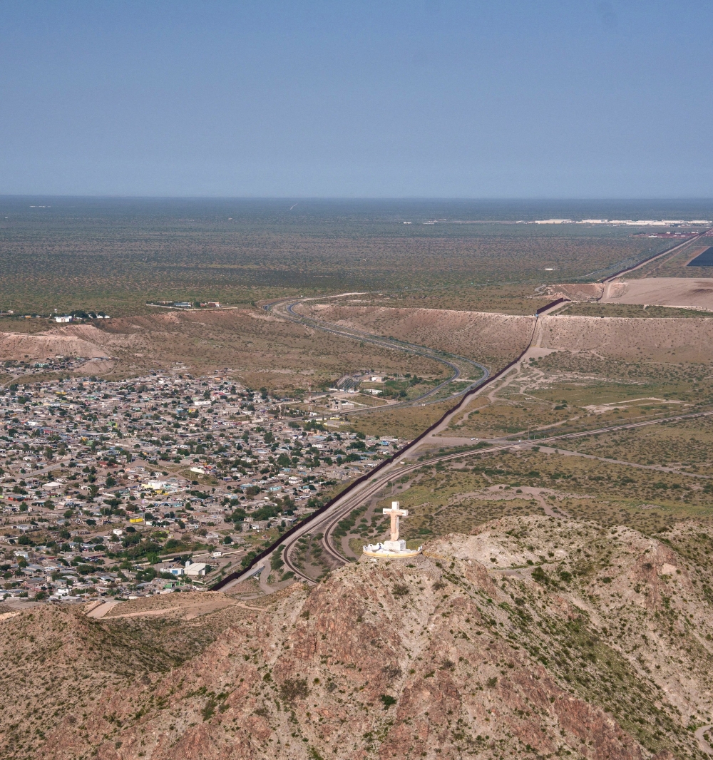 An aerial view shows a cross atop Mount Cristo Rey near the U.S.-Mexico border in Sunland Park, N.M., Aug. 8, 2025. The Diocese of Las Cruces, N.M., called the Trump administration's plans to seize land from the pilgrimage site for building a sector of the U.S.-Mexico border wall an "affront to religious liberty" in a June 19 opposition response filed in U.S. District Court for the District of New Mexico. (OSV News/Paul Ratje, Reuters)
